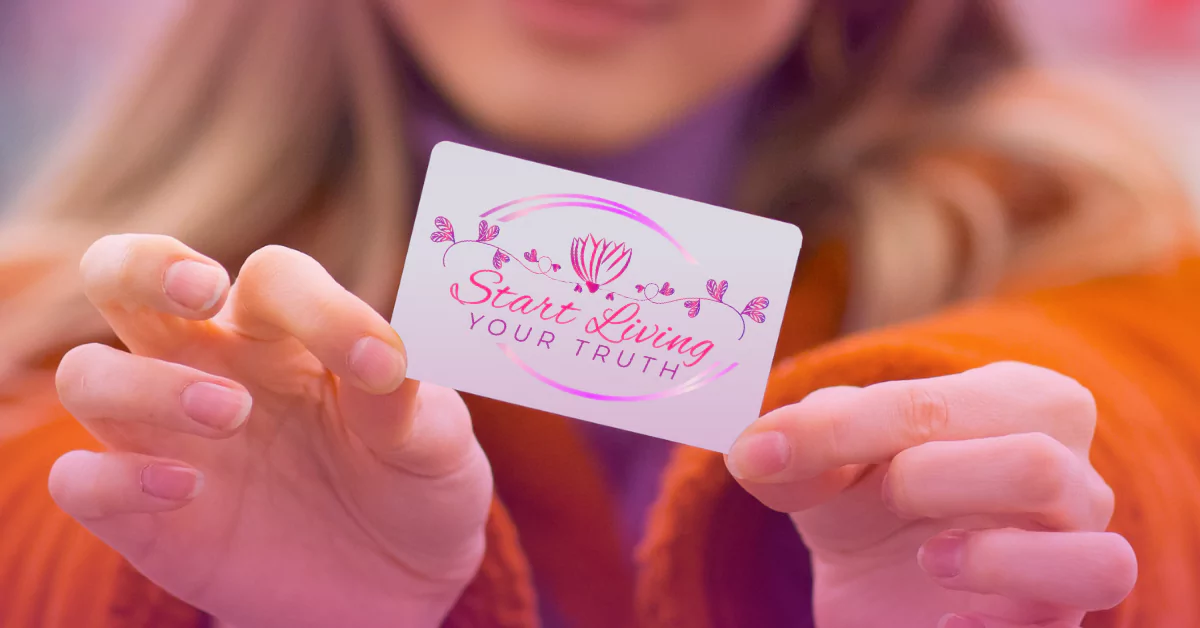 Person holding "Start Living Your Truth" inspirational card.