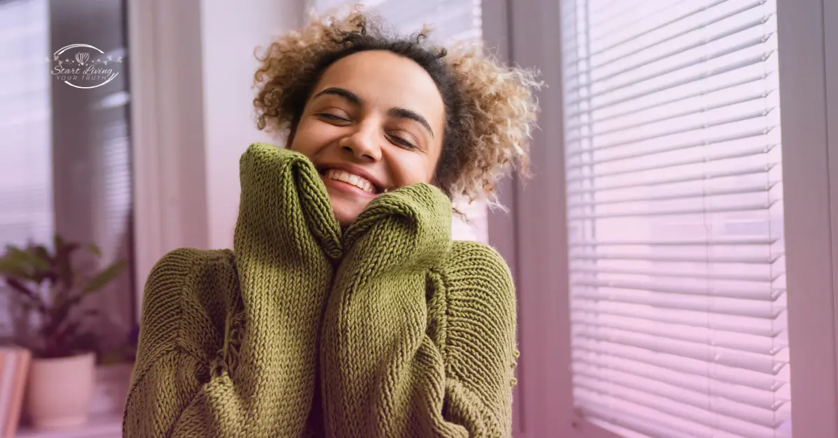 Woman smiling in green sweater indoors