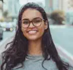 Person smiling on urban street background